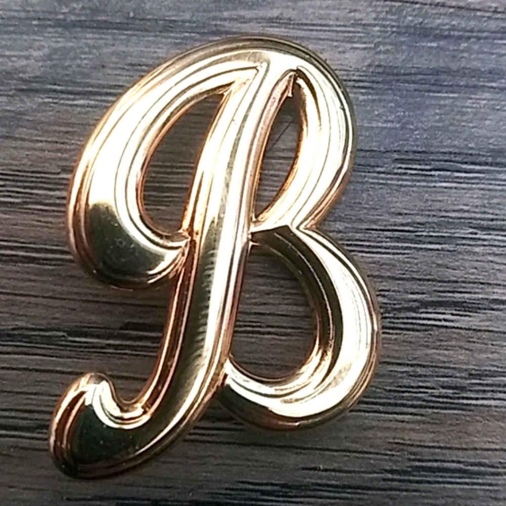 B brooch